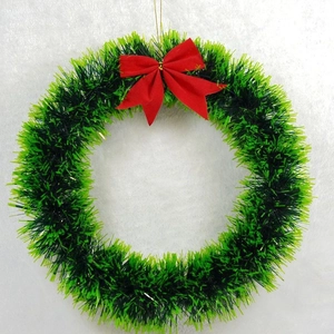 Classic green Christmas wreath with large red bow decoration on white background