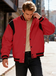Detail of red and black varsity jacket featuring metal snaps and ribbed cuffs for men