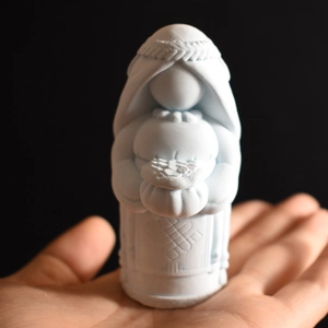 Macro shot of 3D Virgin Mary candle mold detail showing fine textures on blue silicone