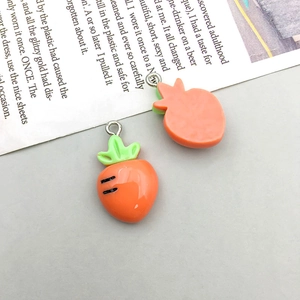 Detailed front and back view of orange resin carrot charms with green leaf accents