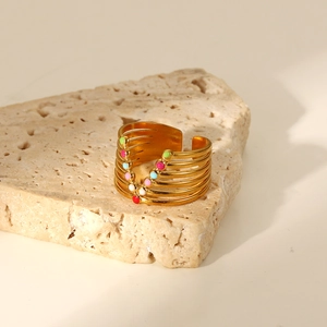 Detail of 18K gold plated multi-layer open ring with colorful enamel beads on stone