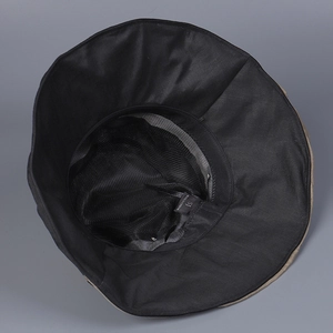 Detail of breathable black mesh lining and sweatband inside the ramie sun hat