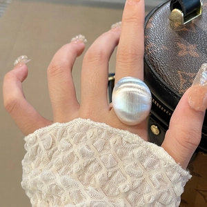 Vintage brushed silver square ring for women featuring minimalist oval metal texture
