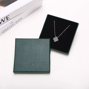 Square dark green linen texture jewelry box for necklace and ring storage with velvet lining