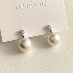 Elegant 925 sterling silver pearl earrings with zircon inlay on a white display card