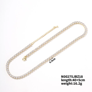 Detail view of gold tennis necklace with white cubic zirconia measuring 0.4cm in width