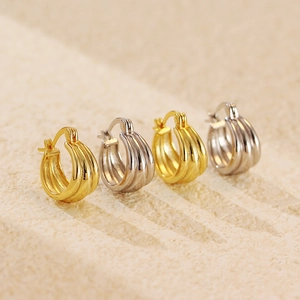 Elegant s925 silver and gold huggie hoop earrings featuring a triple row minimalist design