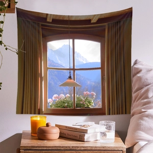 Detail of wall tapestry featuring snow mountains and forest view from a window