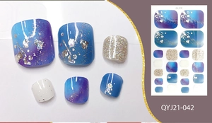 Glittering blue gradient toenail wraps with silver sequins and stylish rhinestones