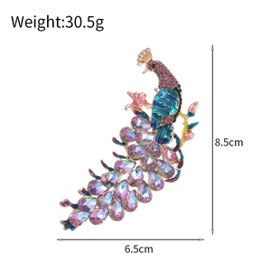 Luxurious peacock feather brooch with colorful enamel and sparkling rhinestones