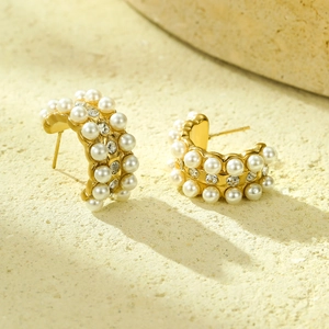 Elegant C-shaped gold-plated earrings with three rows of pearls and sparkling zircon stones