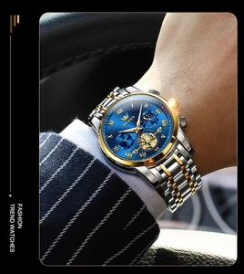 Close-up of luxury men's multifunction watch with blue dial and gold-silver steel band