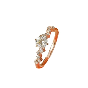 Sparkling wave-shaped rose gold ring with brilliant moissanite stone and diamond accents