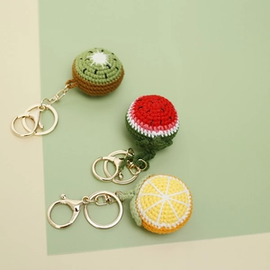 Handmade crochet fruit keychains set featuring kiwi, watermelon, and orange slices