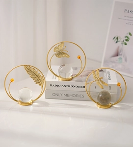 Detailed view of luxury gold iron rings with crystal spheres and nature elements