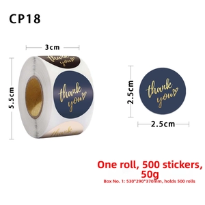 Detailed view of dark blue round thank you stickers with gold foil lettering and hearts