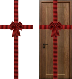 Detail of red and black buffalo plaid ribbon and bow set on a wooden door