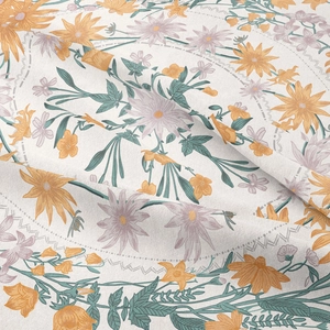 Macro detail of bohemian floral tapestry fabric showing woven texture and flower patterns