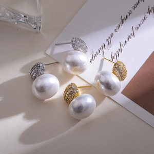Elegant French vintage pearl drop earrings with sparkling diamonds in gold and silver finish