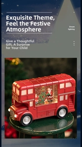 Detail of red Christmas bus lamp with mini Santa scene and warm festive lighting