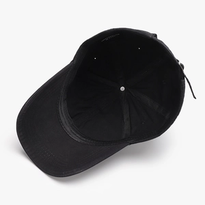 Black cotton baseball cap with curved brim showing the interior lining and soft crown structure
