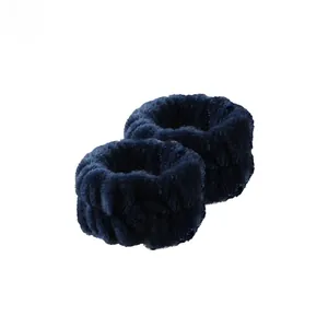Detail of soft coral fleece wristbands in deep blue for washing face and soaking up water