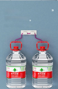 Close-up of the heavy-duty wall-mounted adhesive hook showing strong load-bearing capacity