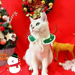 Green knit pet Christmas collar with white snowflakes and bells for small dogs and cats