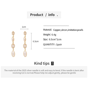 Detailed view of vintage zircon and pearl drop earrings with 6.5cm size dimensions