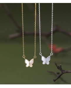 Detailed view of S925 silver butterfly necklaces with white mother of pearl insets