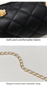 Detail of black quilted leather texture with golden camellia hardware and chain strap