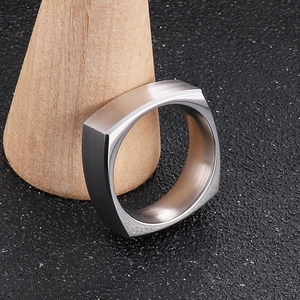 Macro view of square stainless steel men's ring with horizontal brushed matte finish
