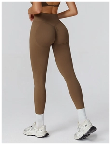 Close-up of seamless dark brown yoga pants showing high waist and scrunch butt detail