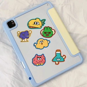 Detailed view of colorful cartoon monster stickers applied on a blue tablet case