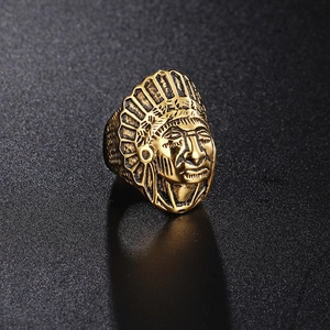 Detailed relief of vintage gold steel Indian chief ring with intricate punk carving
