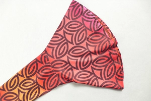 Macro shot of flared sleeve detail with vibrant geometric pattern and fine stitching
