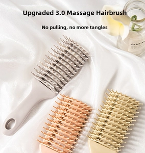Detail of hollow vented massage hair brushes in grey, orange and beige colors