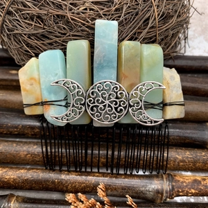 Detail of bohemian hair comb with natural blue and yellow raw crystals and silver moon