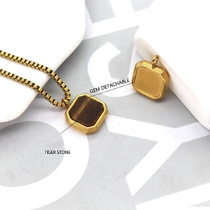 Detail of square tiger stone pendant showing detachable gem feature on box chain