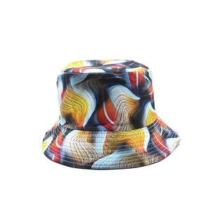 Close-up of colorful tie-dye bucket hat with abstract wave patterns and fine stitching