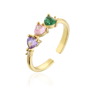Detailed view of irregular gold ring with colorful heart stones and cubic zirconia