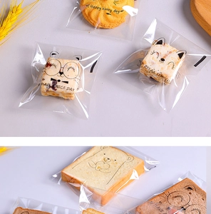 Detailed view of clear self-adhesive bread bags with cute cartoon cat prints for bakery