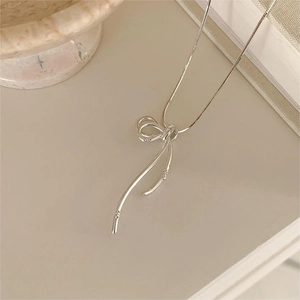 Minimalist 925 sterling silver ribbon knot pendant necklace with sleek snake chain
