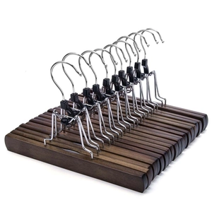Set of 10 adjustable solid wood skirt hangers with non-slip metal clips on white background