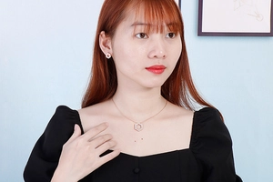 Elegant geometric hexagonal necklace and stud earrings set with sparkling crystals on model