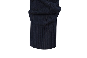 Detailed close-up of navy blue knit sweater cuffs featuring tight ribbing and premium texture