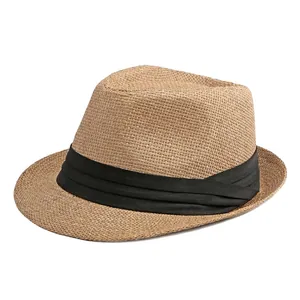 Classic straw Panama hat for sun protection featuring a black band on white background