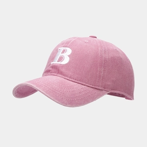 Close-up of pink washed cotton baseball cap featuring 3D white embroidered B letter