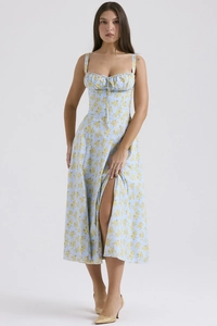 Detailed view of light blue floral dress with side slit and drawstring bow decoration