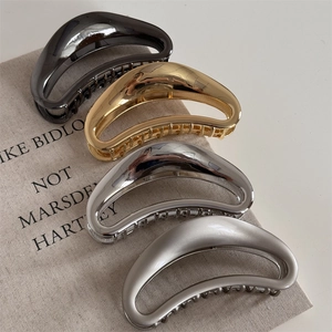 Set of four large hollow crescent metal hair claws in gold silver and matte finishes